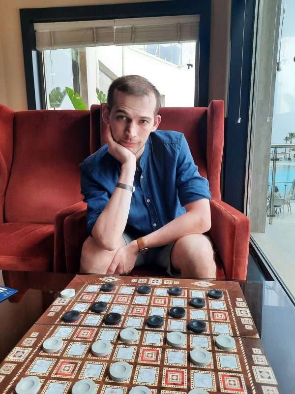 Gleb playing a board game with his friend