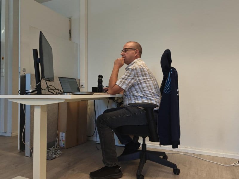 Kyösti working at the office