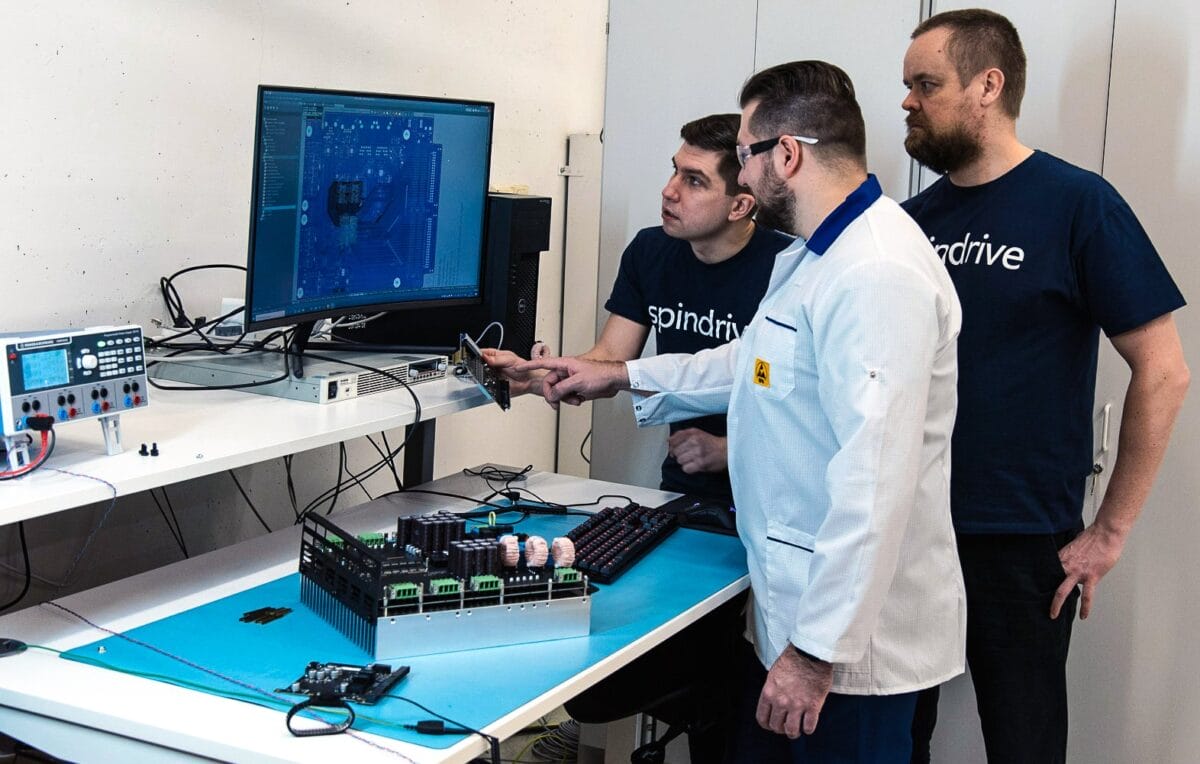 SpinDrive experts looking at a screen
